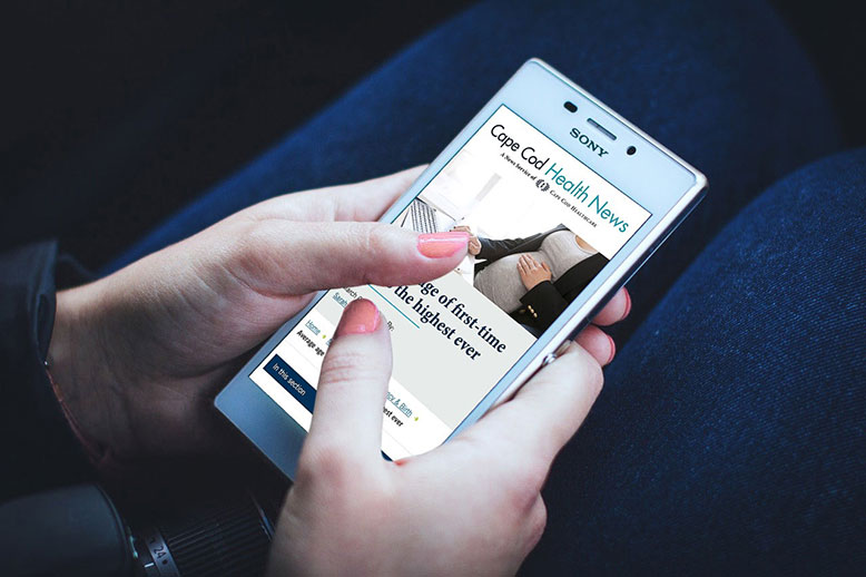 ContentMarketing-CCHN-phone-opt Woman reading a blog post on Cape Cod Health News